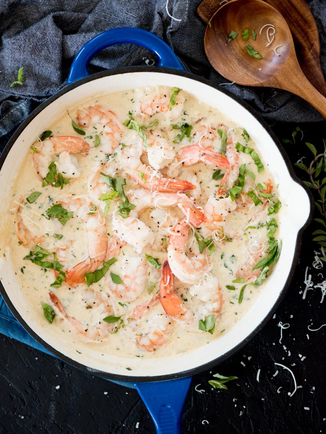 creamy garlic shrimp with parmesan in a blue enamel cast iron skillet