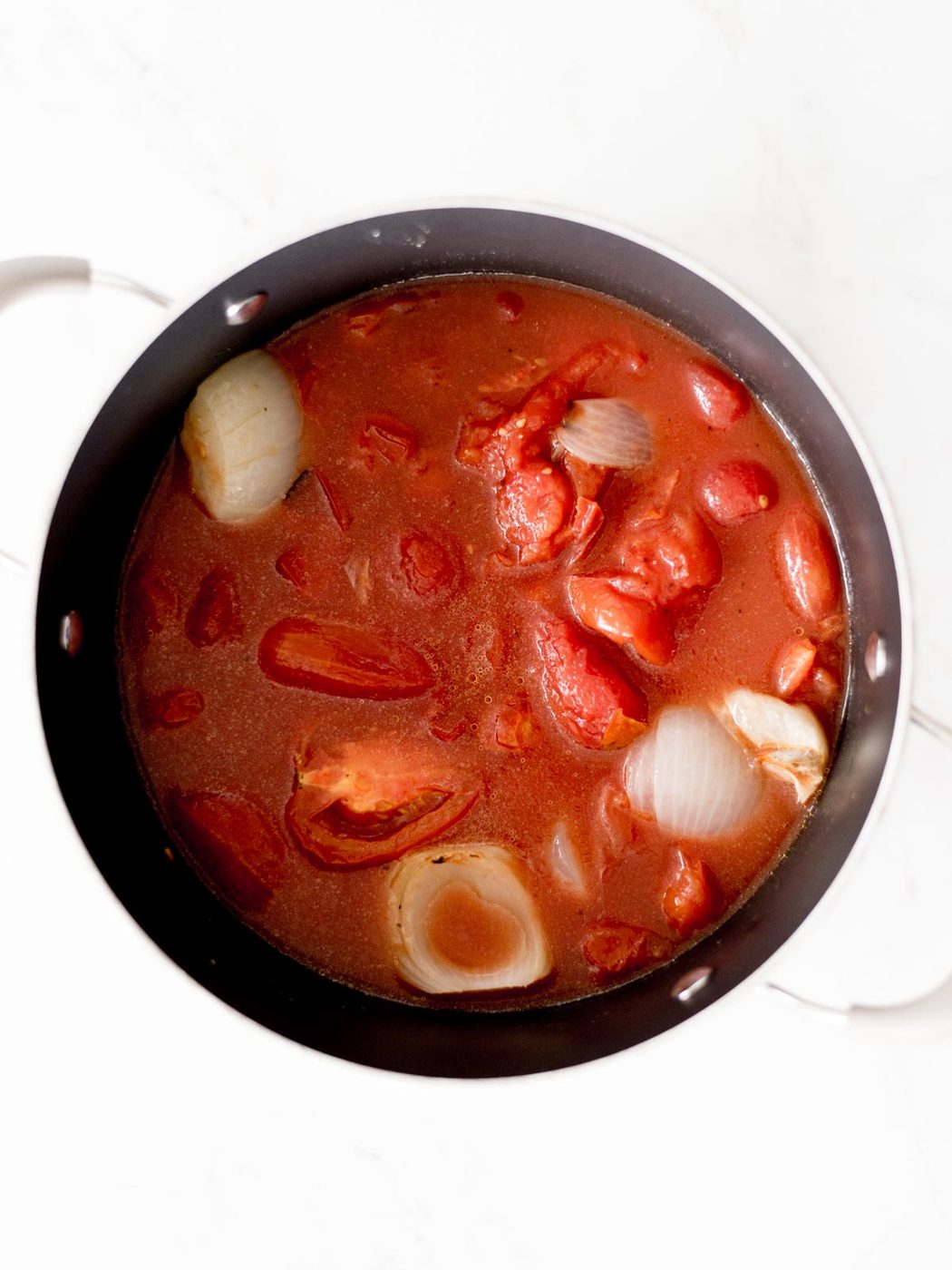 all ingredients of roasted tomato basil soup added to the stock pot