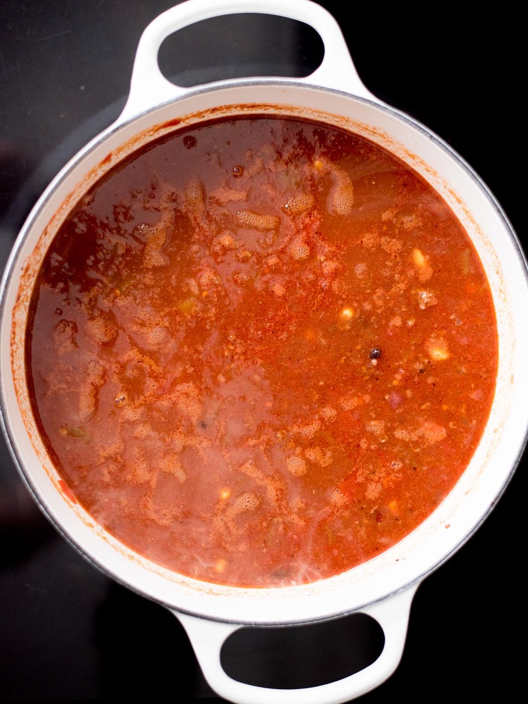 Dutch oven with taco soup ingredients simmering.