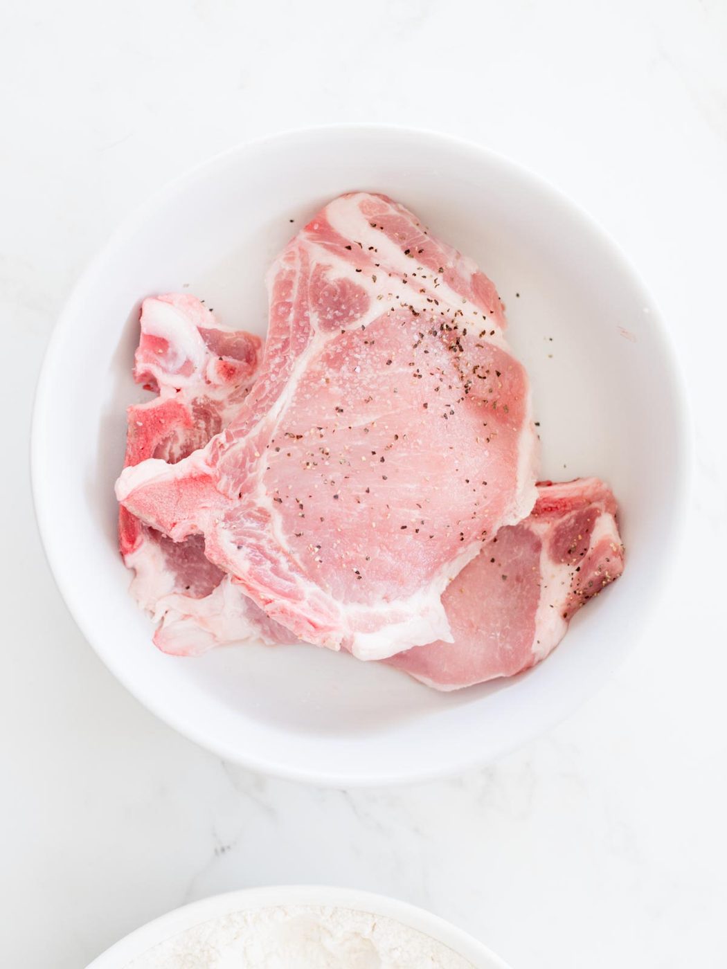 pork chops seasoned with salt and pepper