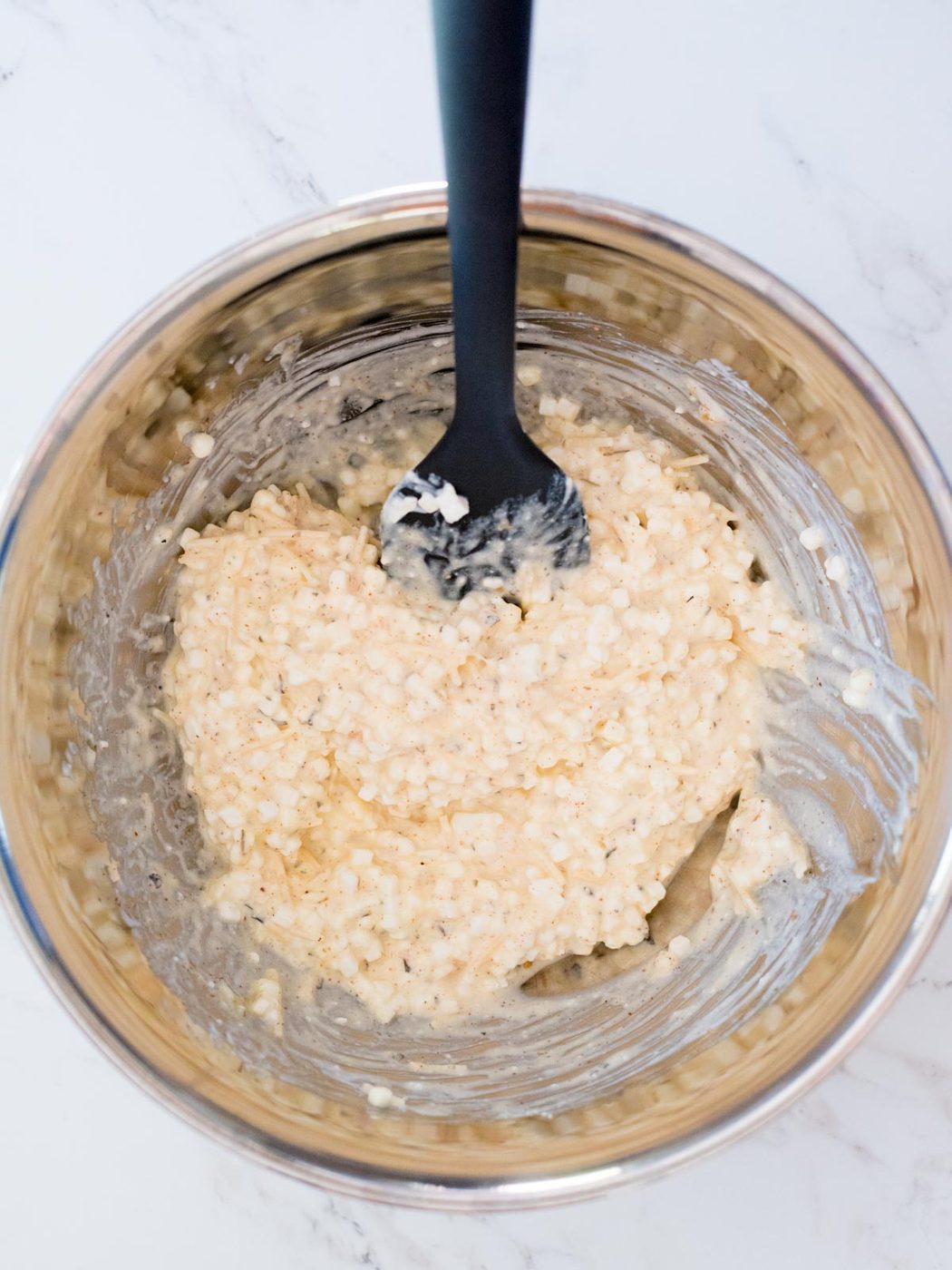 crockpot lasagna cheese filling in a mixing bowl