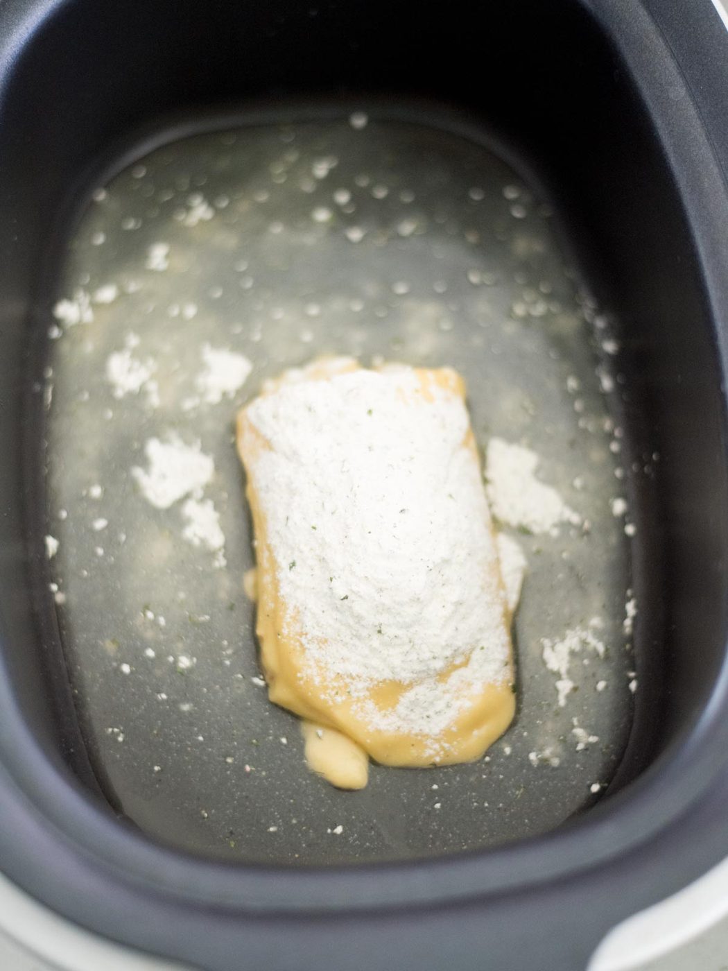 chicken stock, cream of chicken, and ranch in the crockpot
