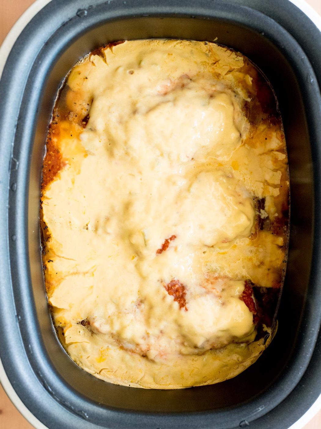 crockpot salsa chicken with queso cooked in the slow cooker sleeve