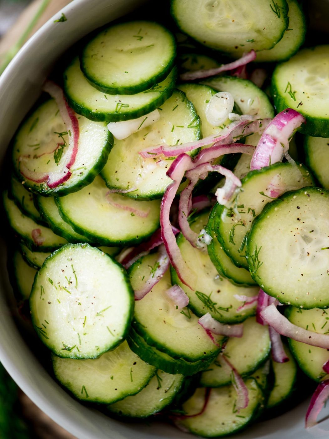 old fashioned cucumbers and onions in vinegar in a bowl