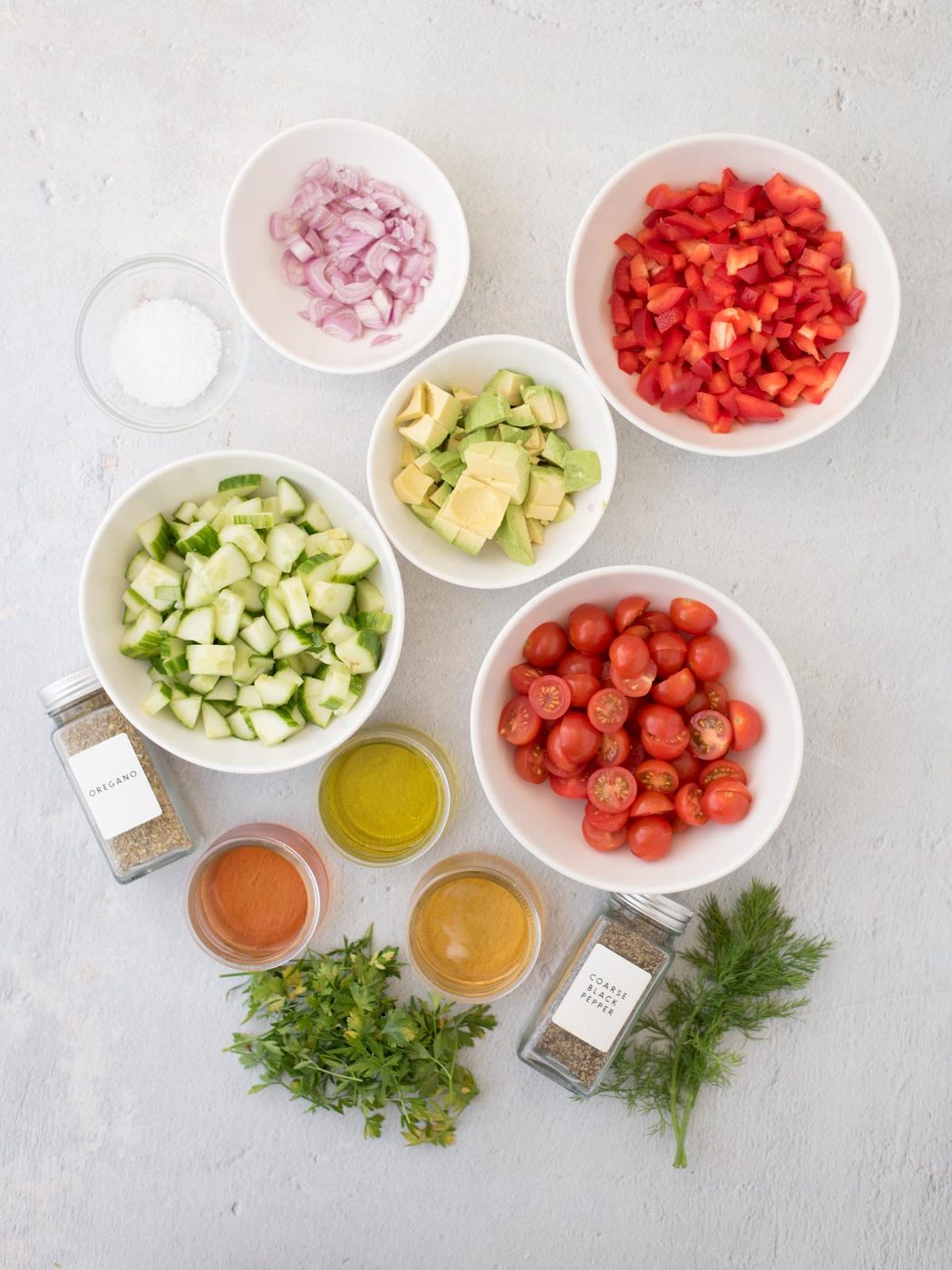 Ingredients shown are used to prepare cucumber tomato salad.