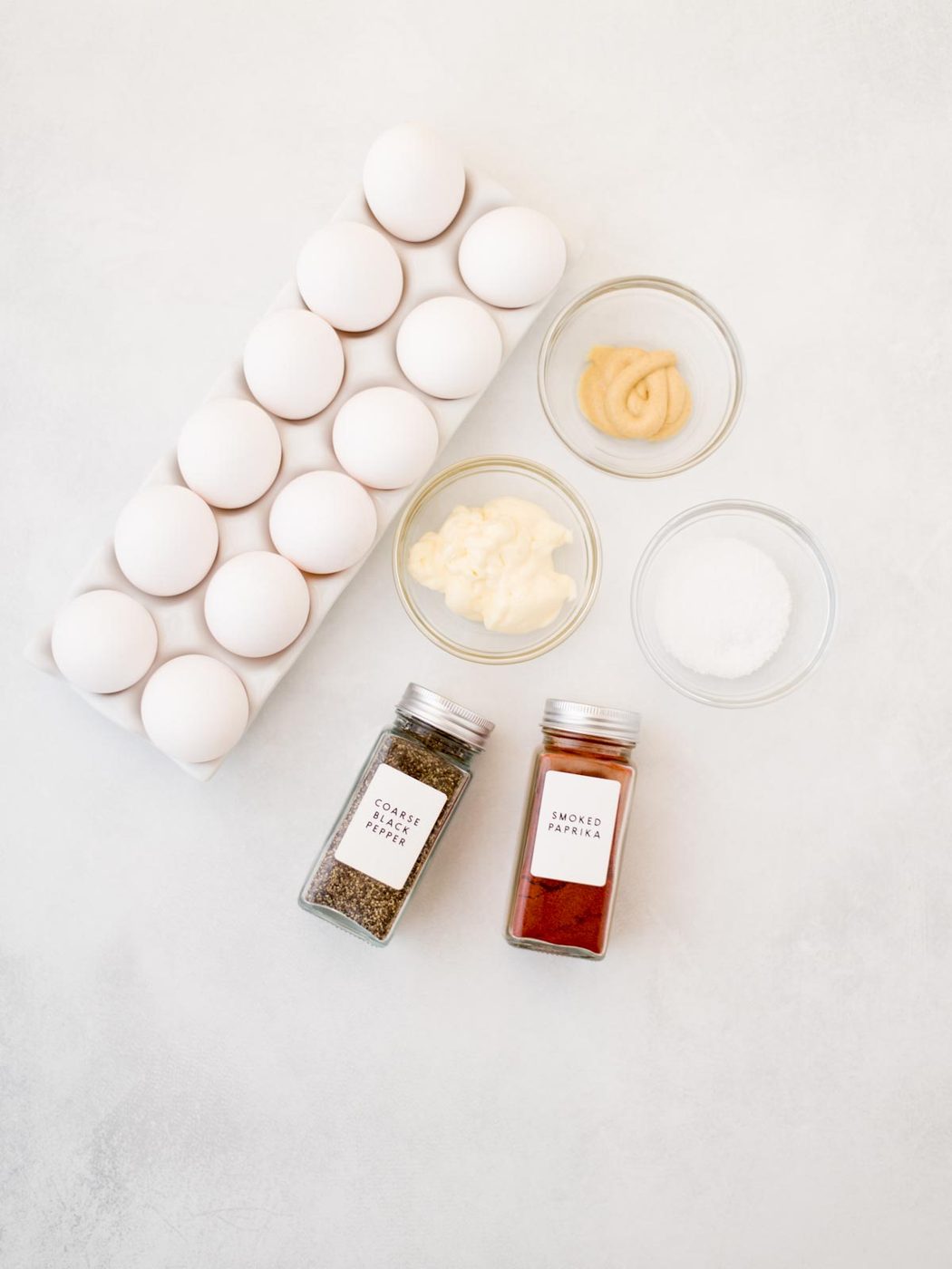 Ingredients shown are used to prepare Deviled eggs.