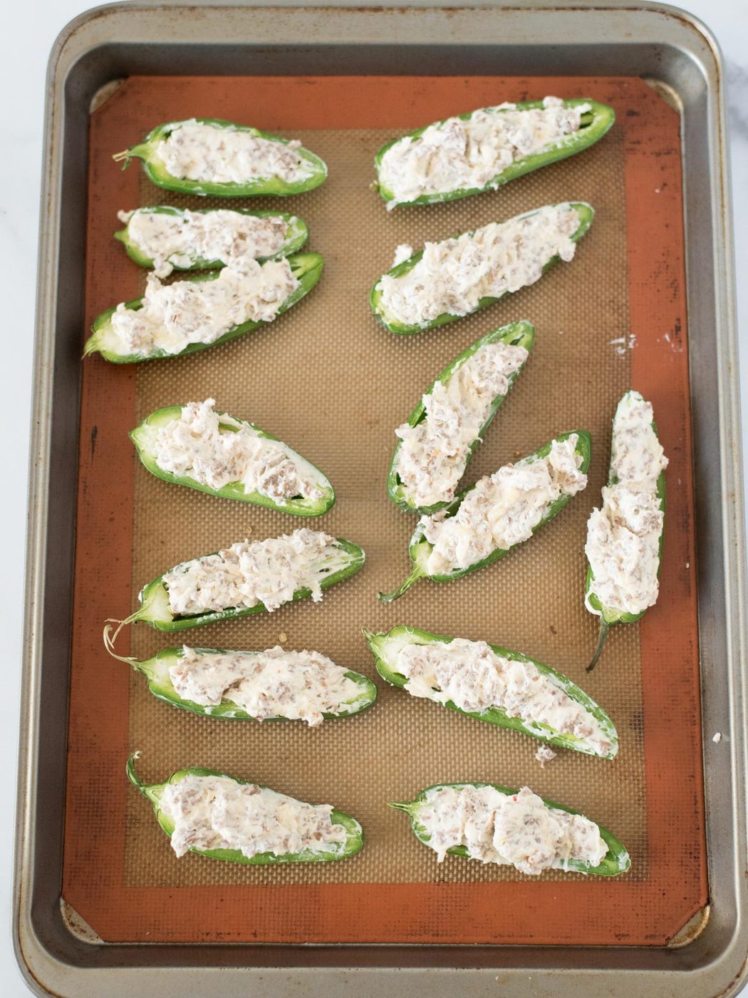 Straightforward Baked Jalapeno Poppers on a baking sheet