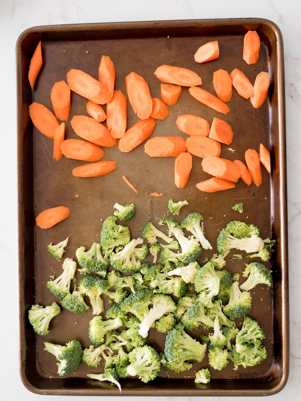 broccoli and carrots on a sheet pan