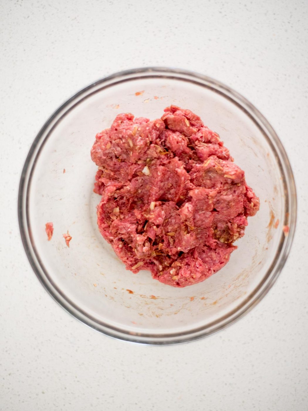 meatball ingredients mixed together in a mixing bowl
