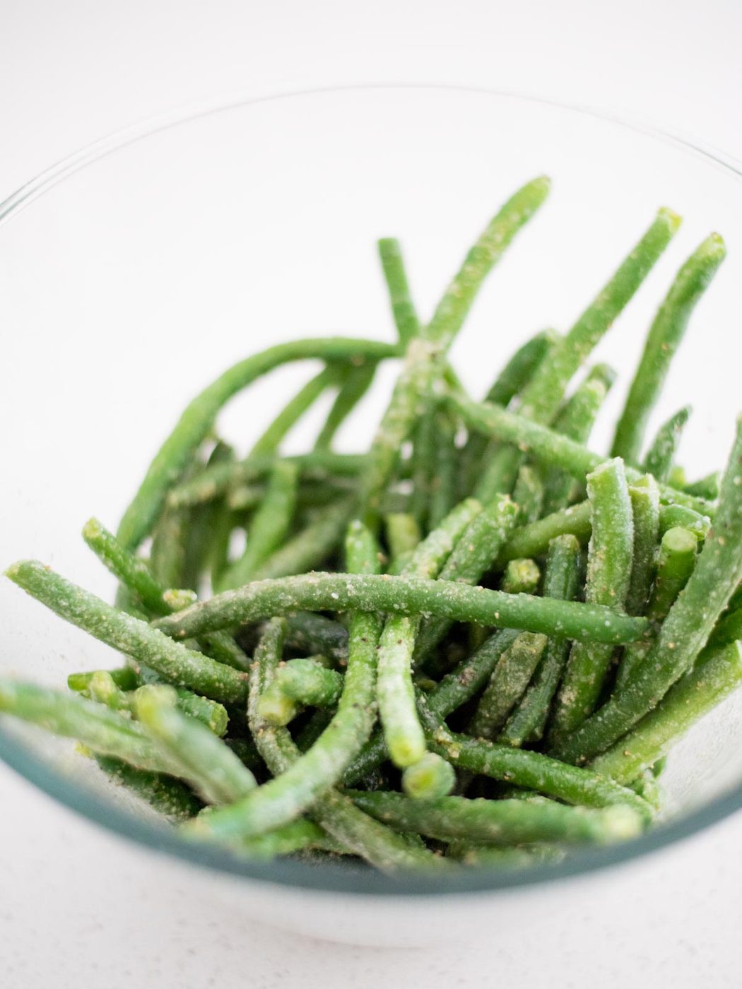 glass bowl of frozen green beans.