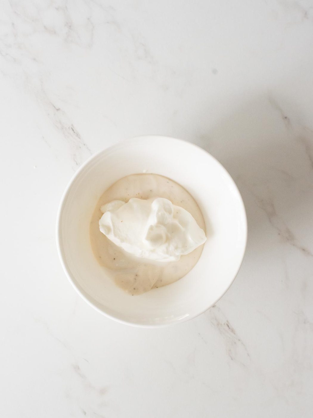 sour cream and ranch in a mixing bowl