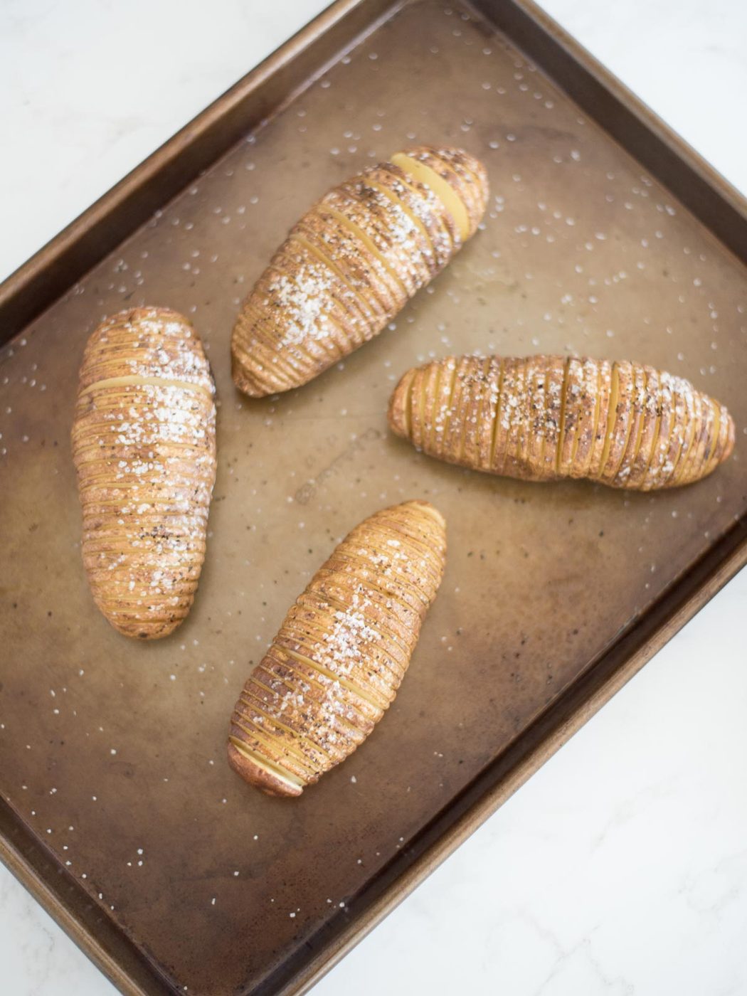 sliced potatoes with butter, salt and pepper