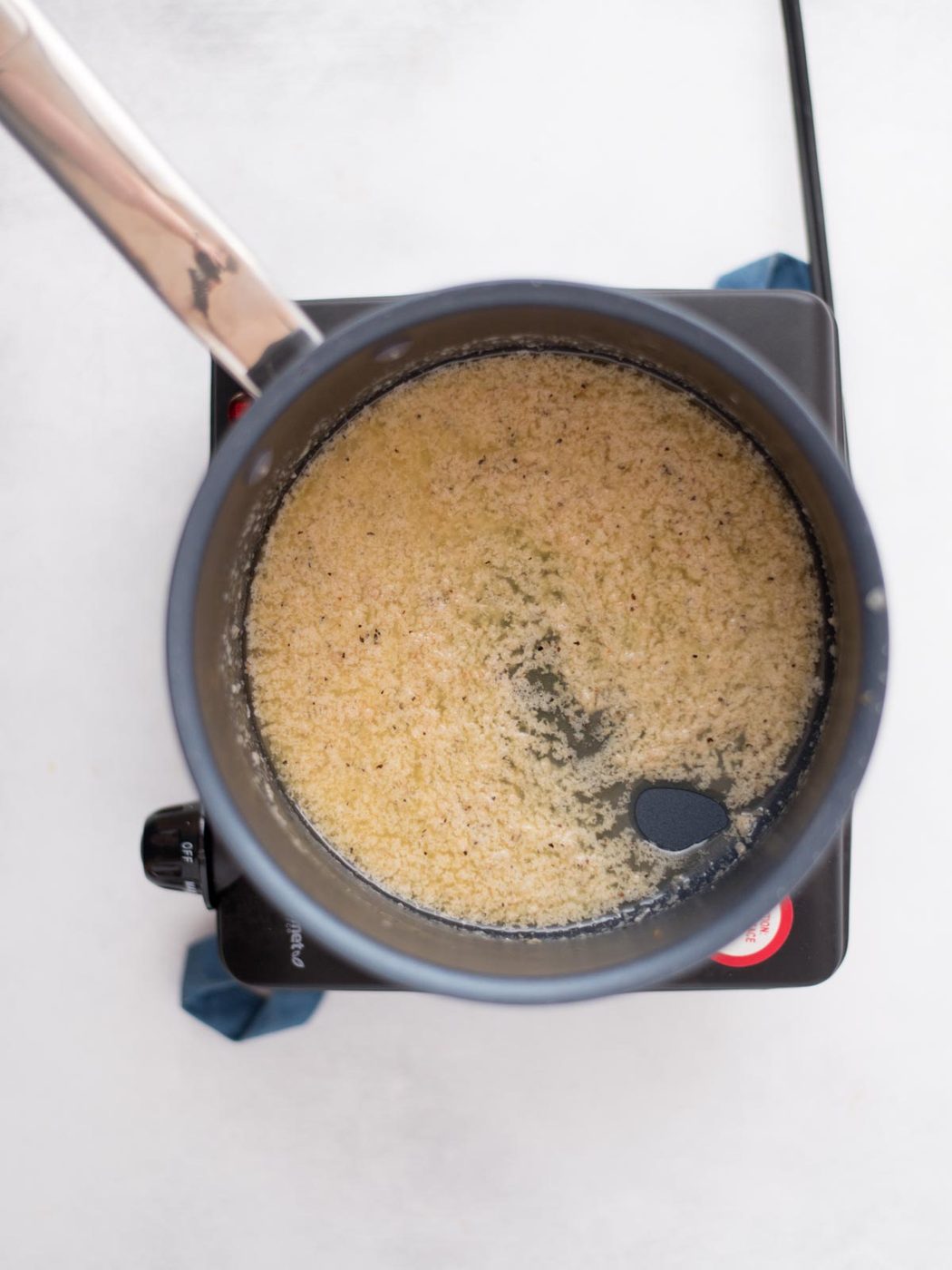 garlic parmesan sauce in a saucepan