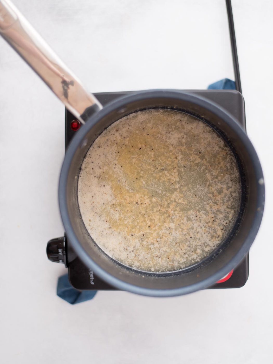 melted butter, garlic, black pepper, and onion powder in a sauce pan