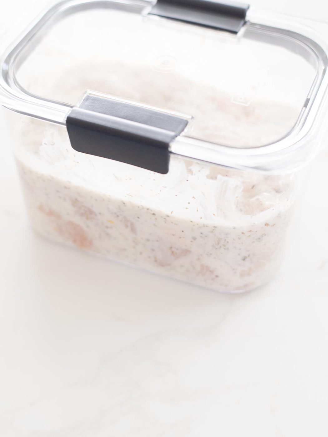 chicken and marinade in an airtight container