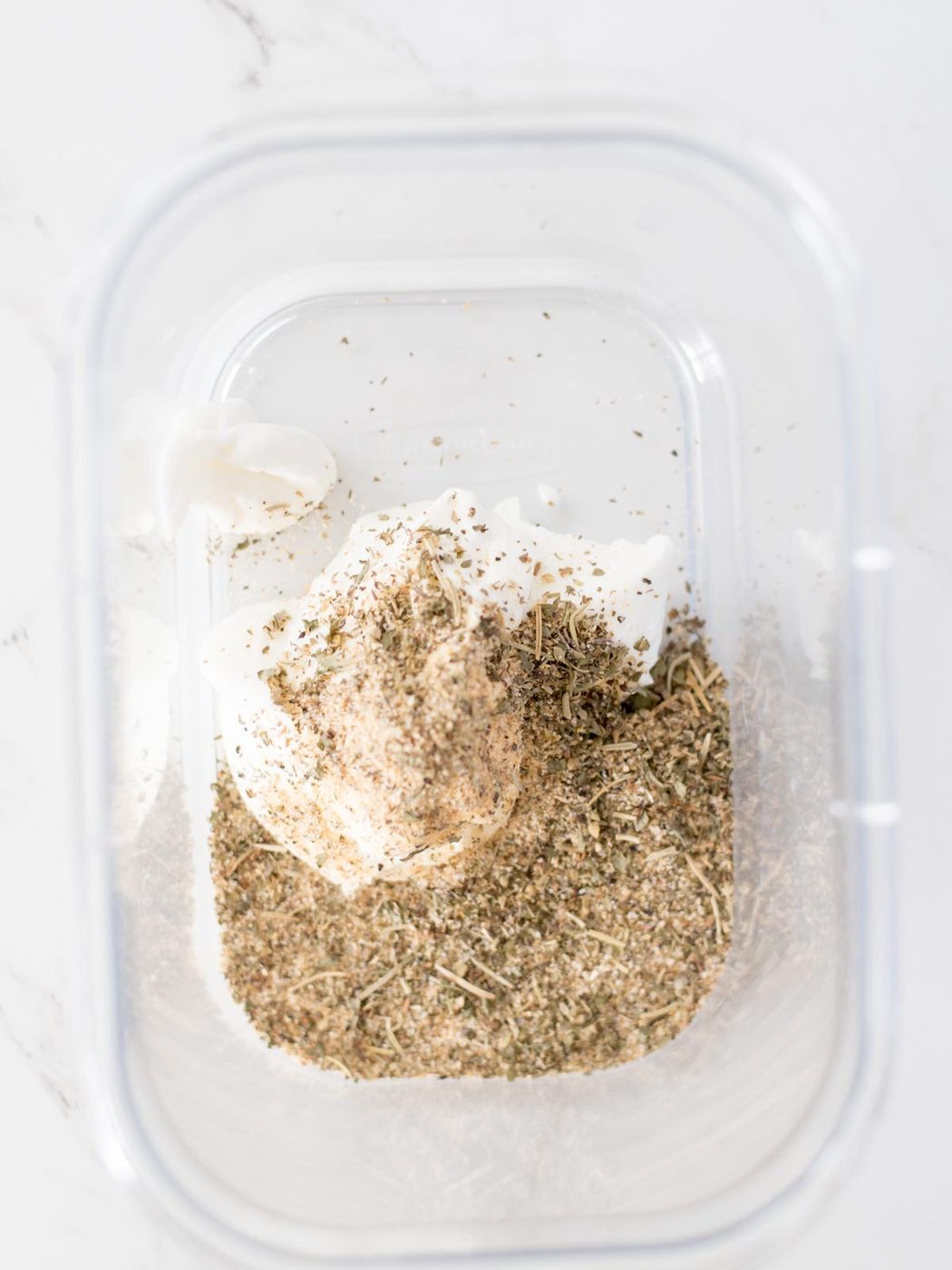 greek seasoning and yogurt in a bowl