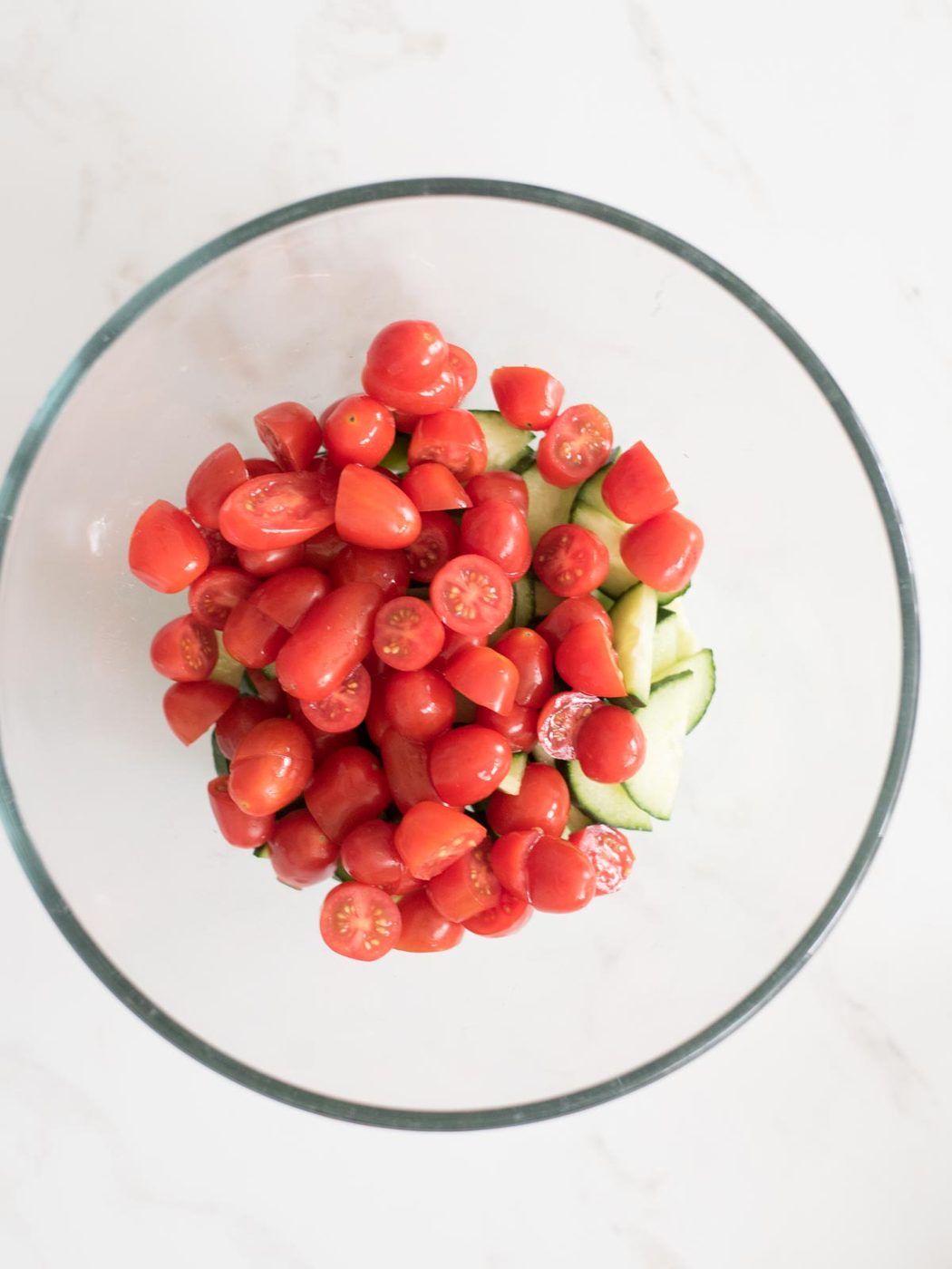 tomatoes added to mixing bowl