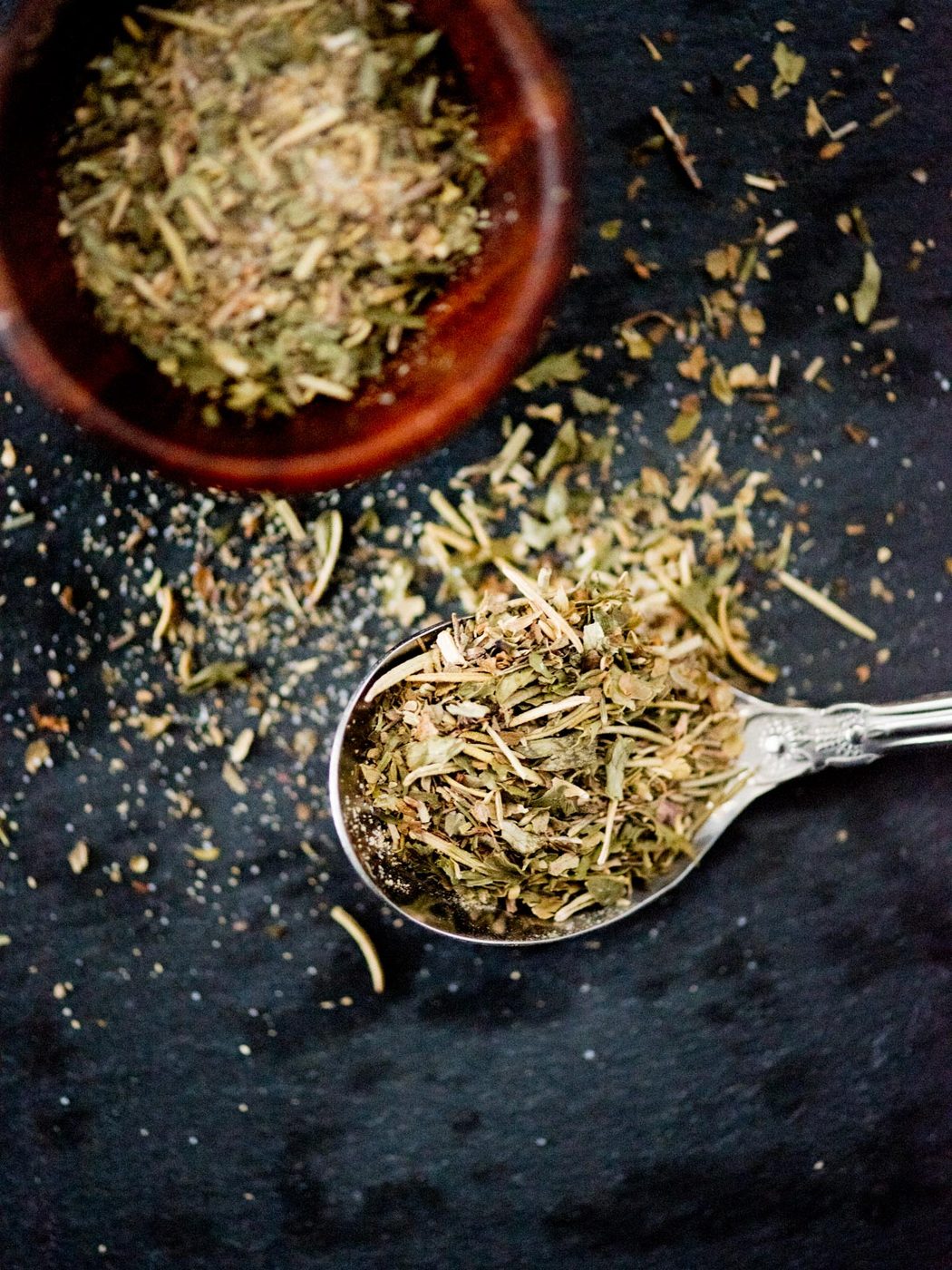 dried Greek herb seasoning in a spoon