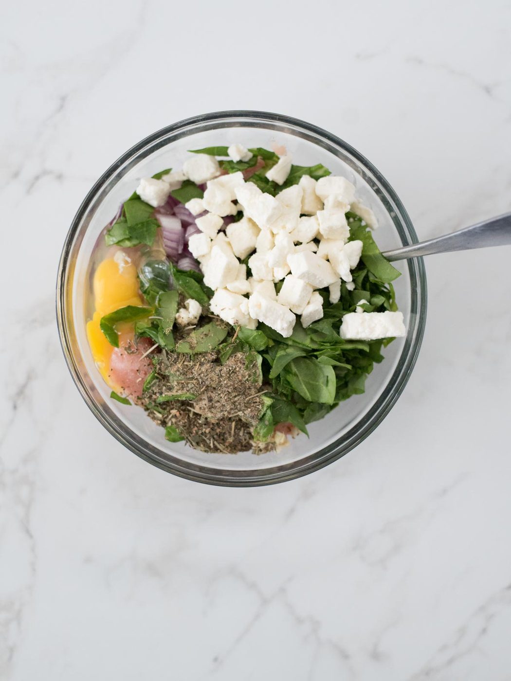 all of turkey burger ingredients in a mixing bowl