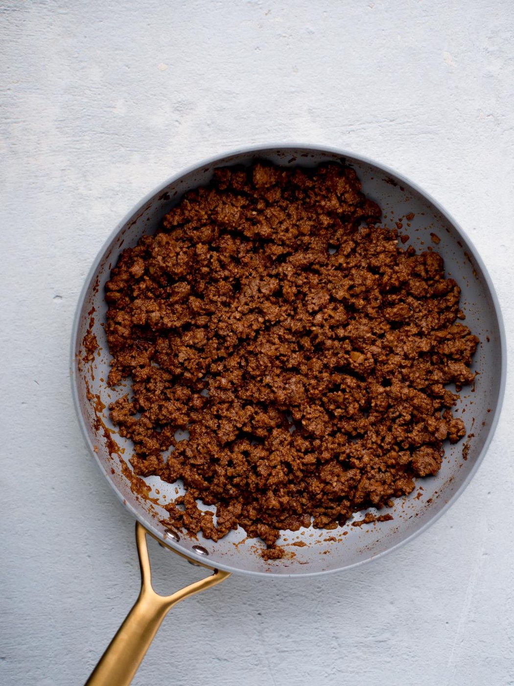 seasoned ground beef for tacos in a skillet