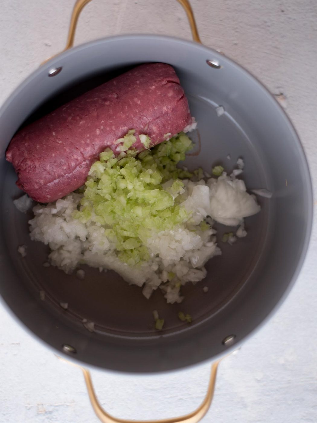 ground beef, celery, and onion in a stock pot