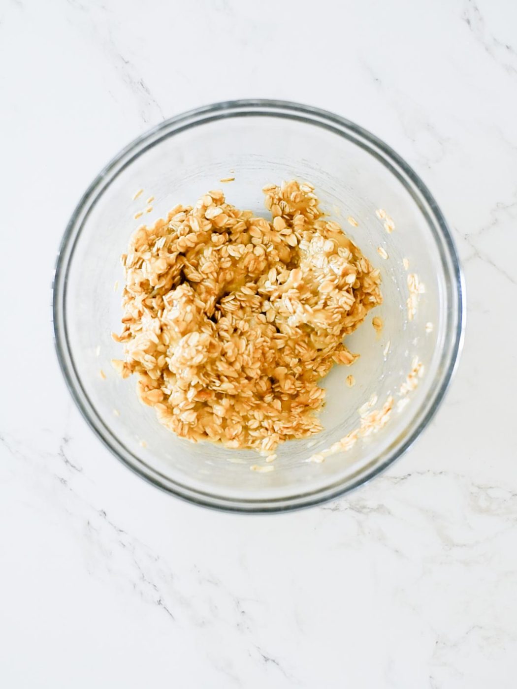 bananas and oats mixed together in a bowl