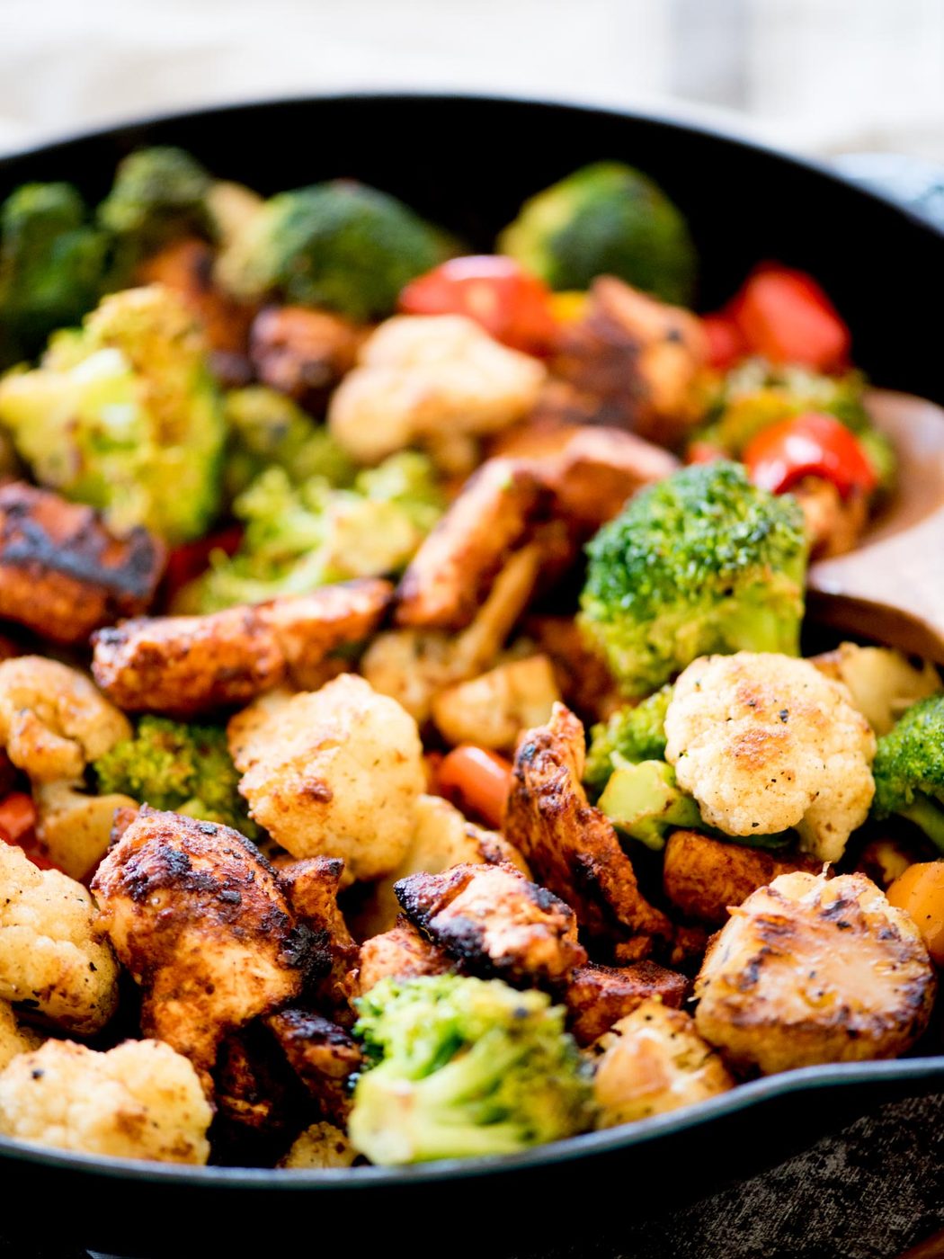 healthy chipotle chicken and vegetables in a skillet
