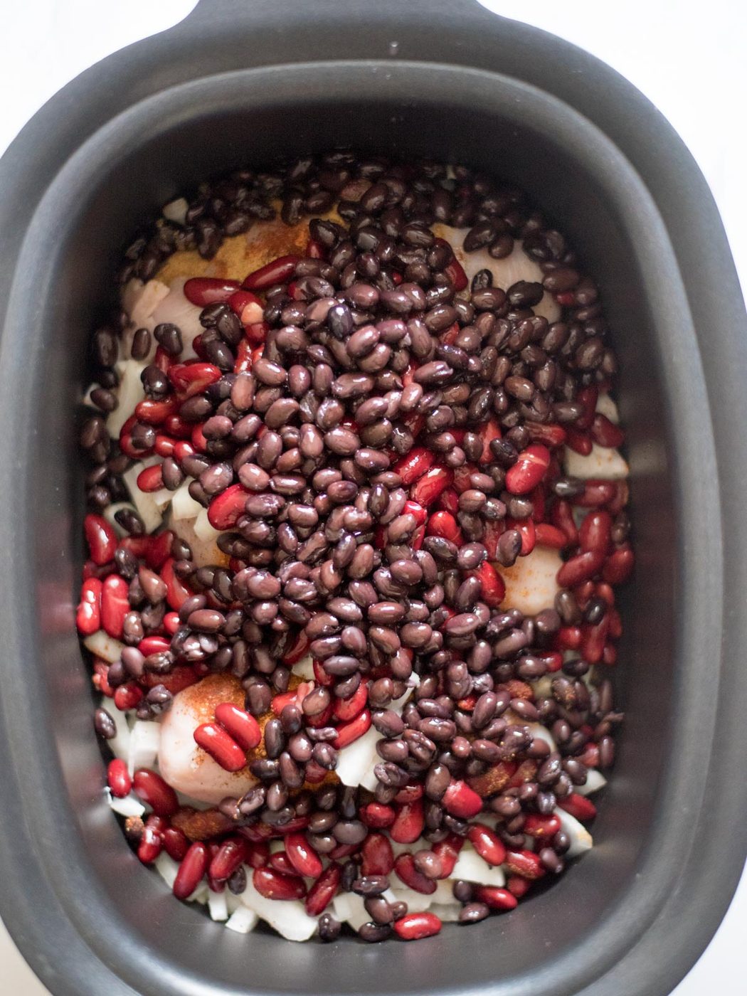 black beans added to kidney beans in a crockpot