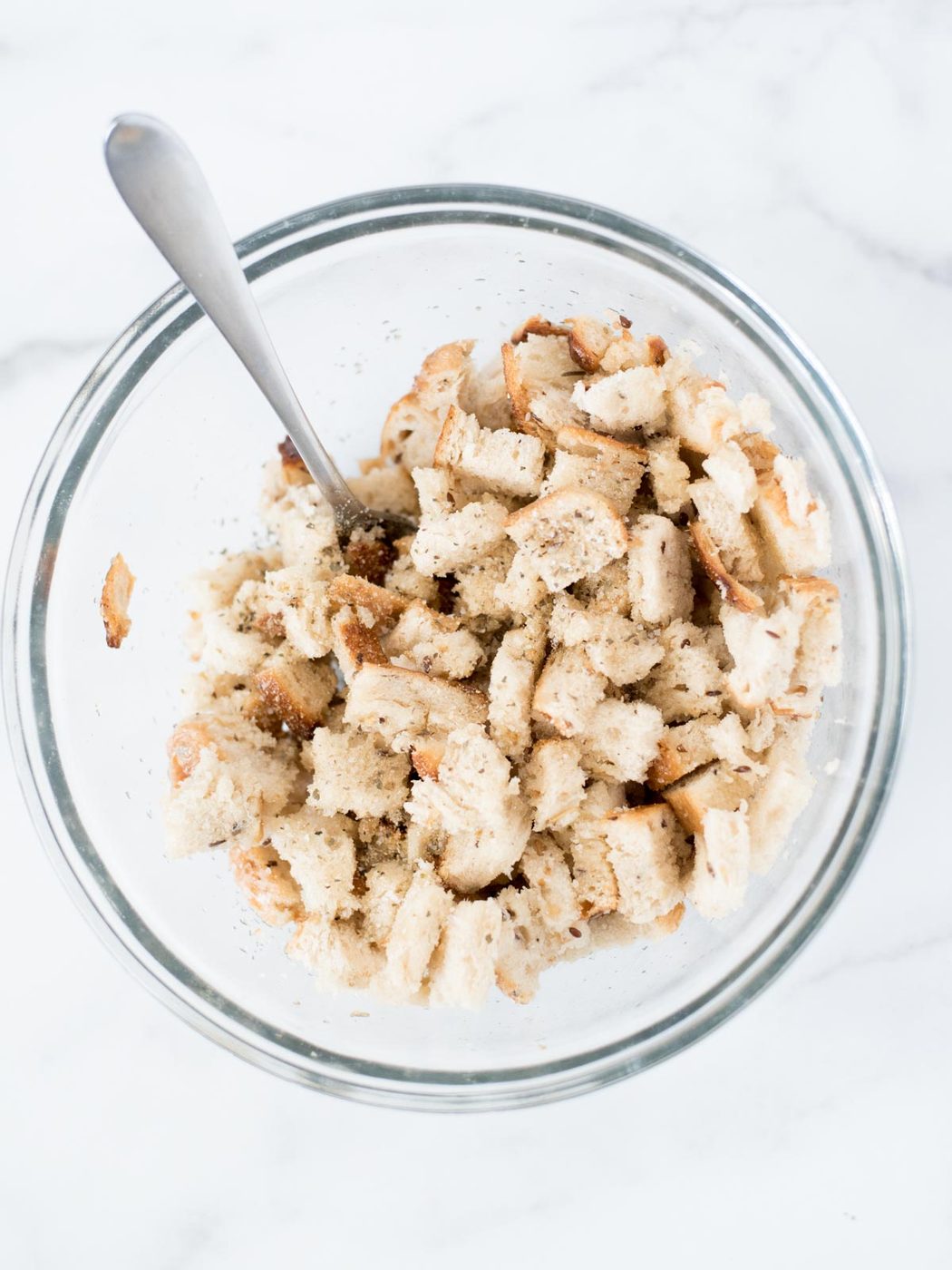 bread in mixing bowl with seasoning