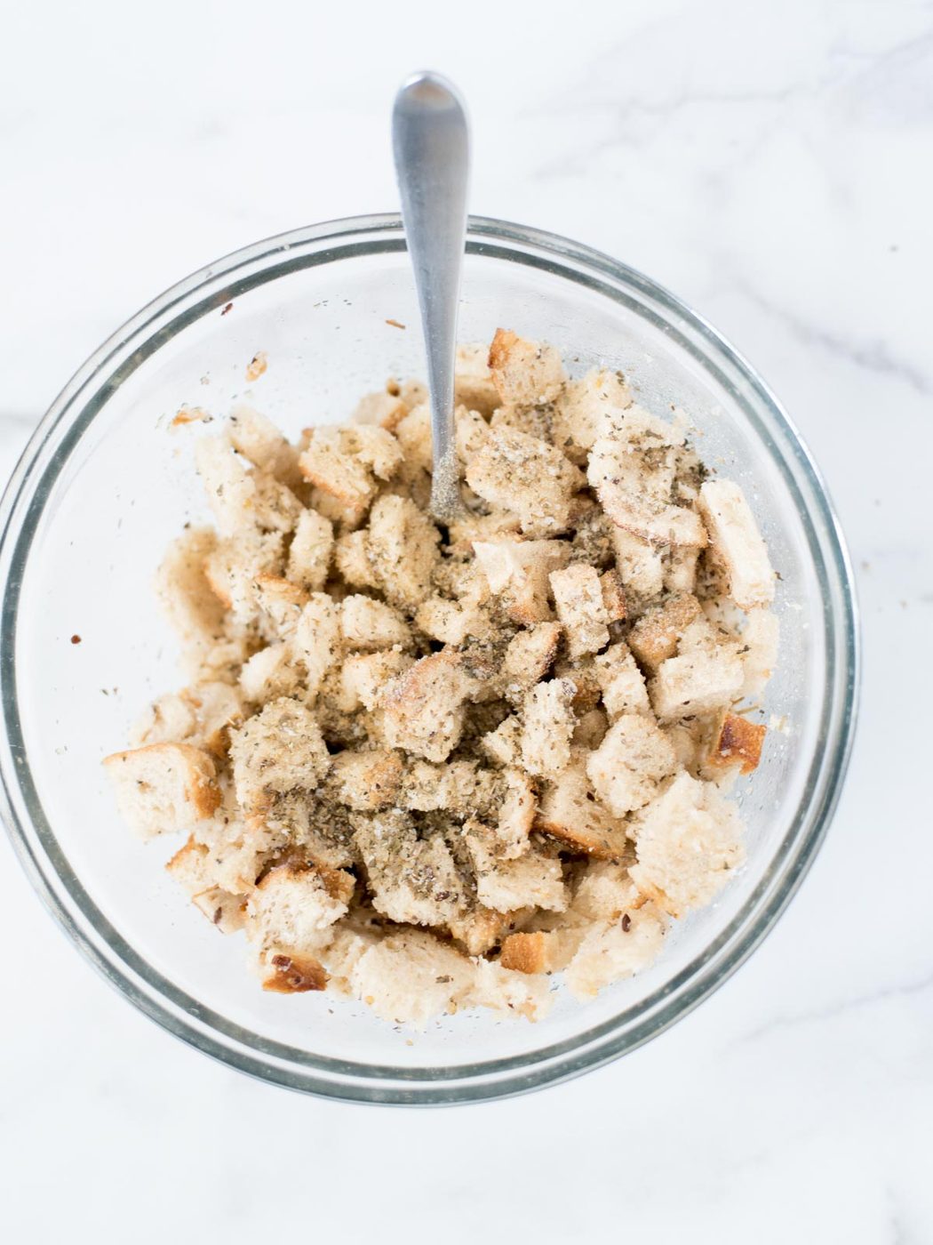 bread in mixing bowl with seasoning
