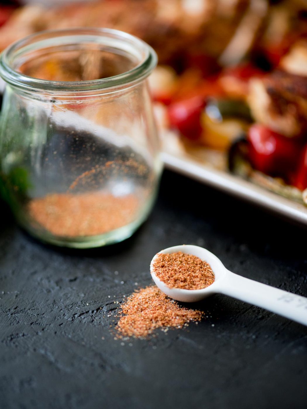 from-scratch fajita seasoning in a jar and measuring spoon