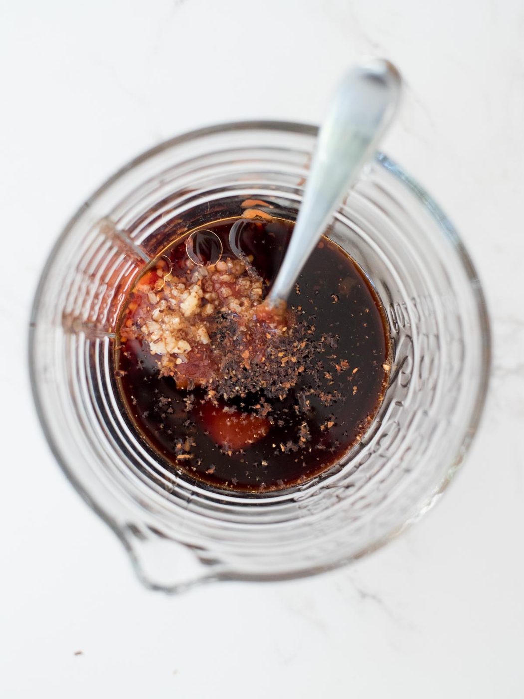 red pepper flakes added to the measuring glass