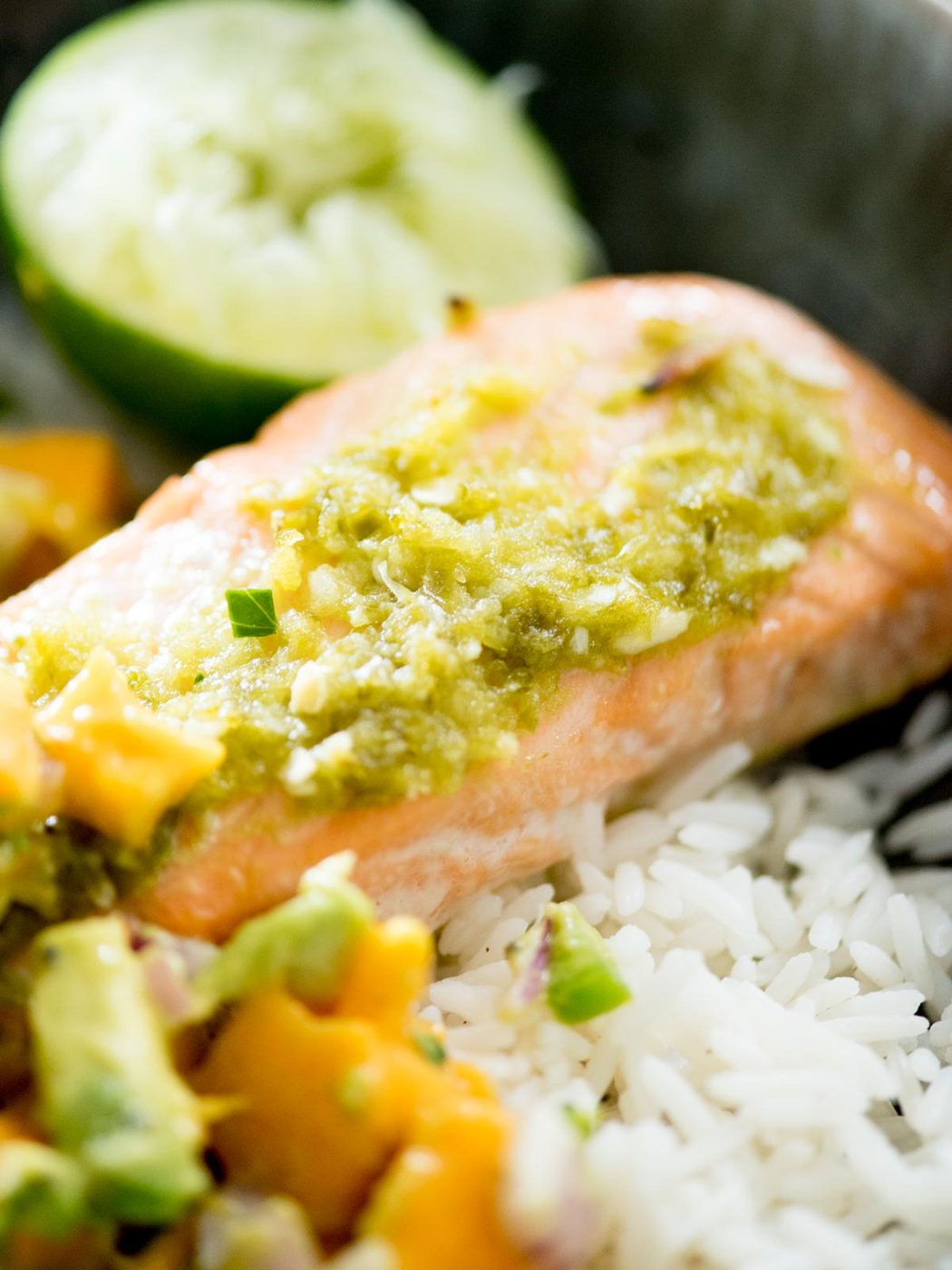 honey jalapeno lime salmon in a bowl with jasmine rice and mango avocado salsa