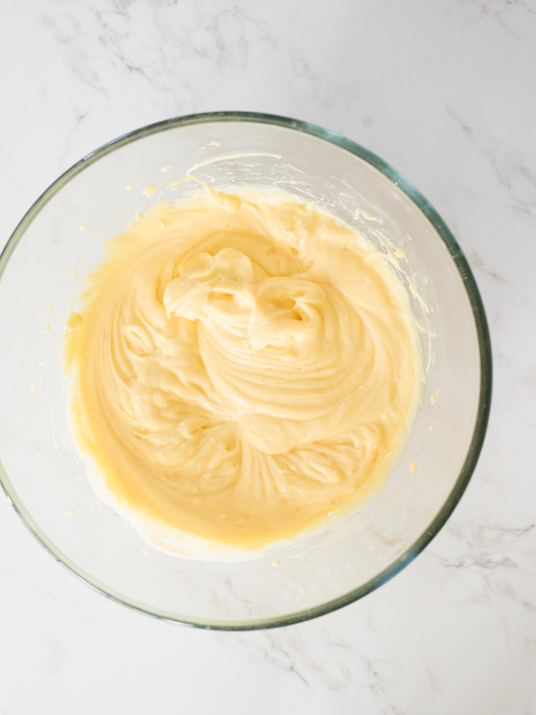 pudding, cream cheese, and sweetened condensed milk combined in a mixing bowl