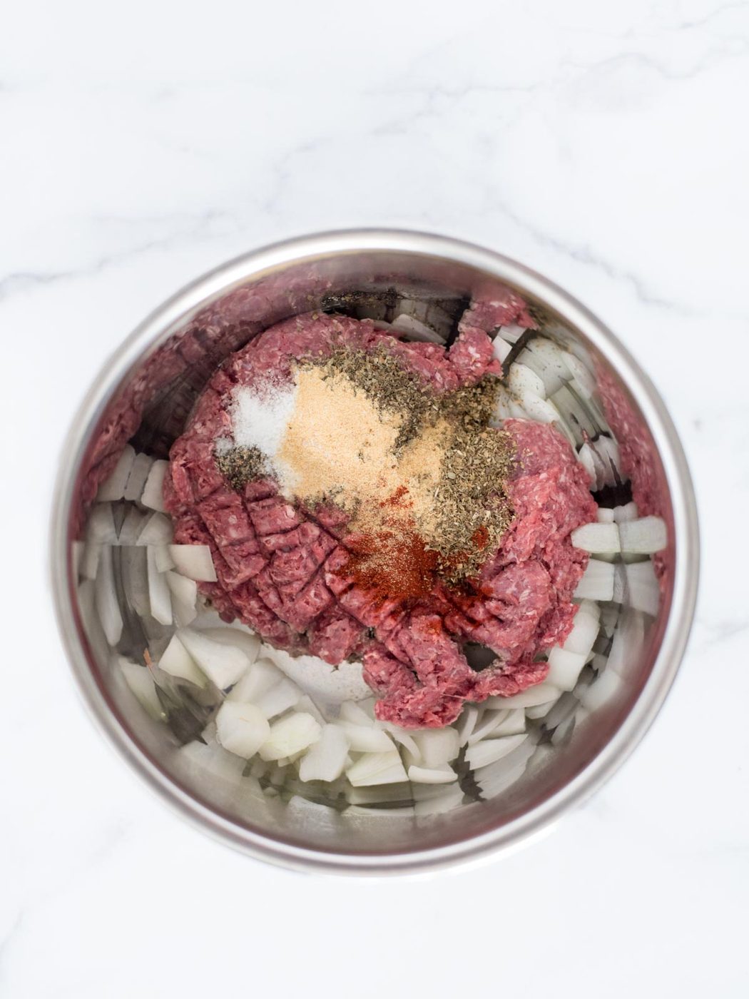 ground beef, onion, and spices in instant pot