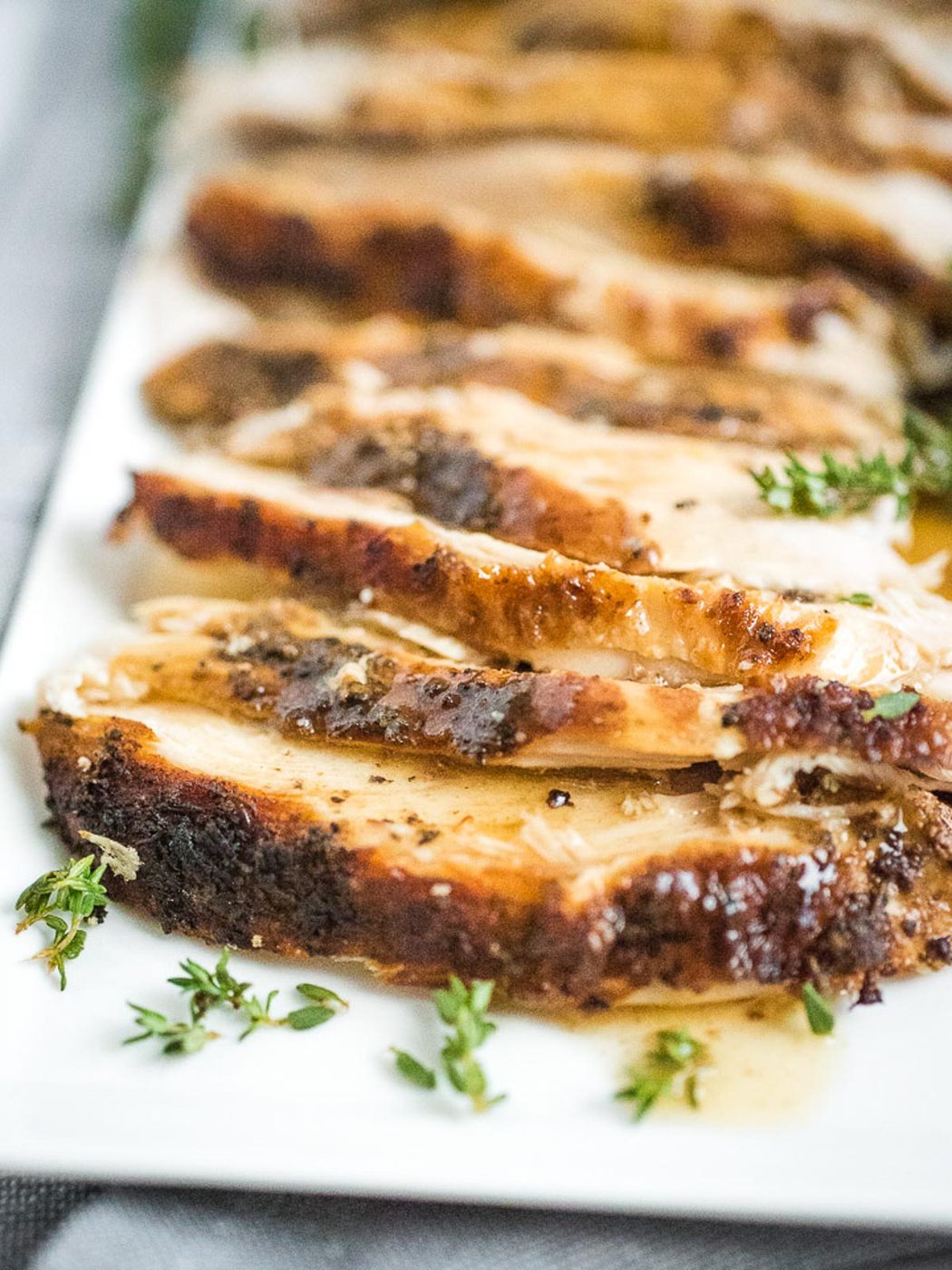 sliced turkey breast on plate with gravy