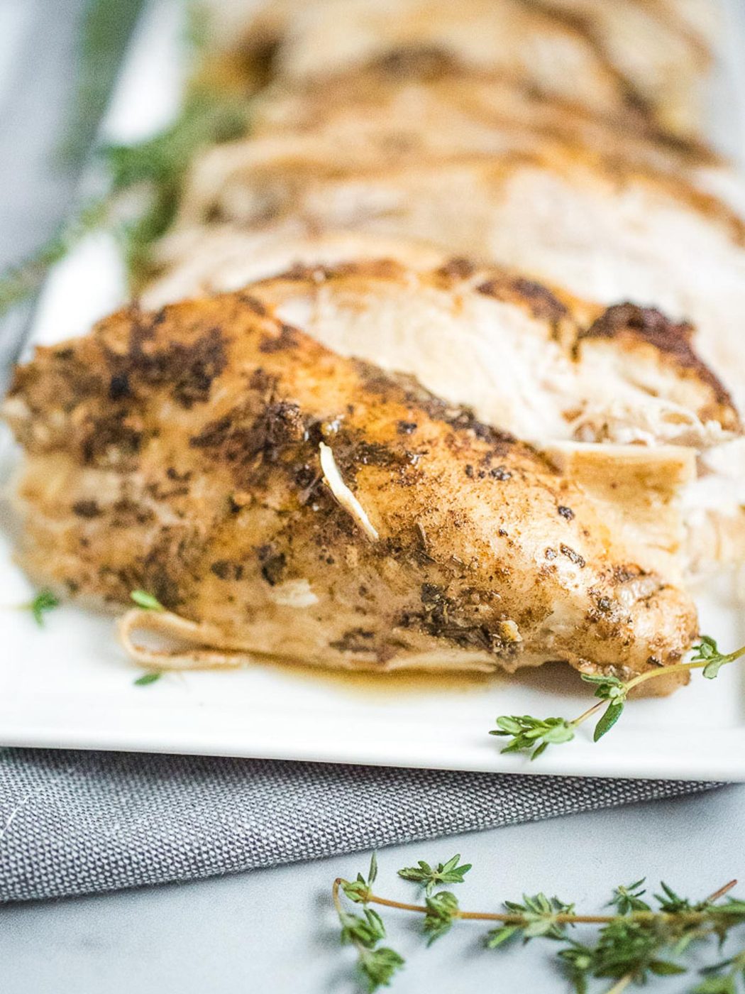 sliced turkey breast on plate with gravy