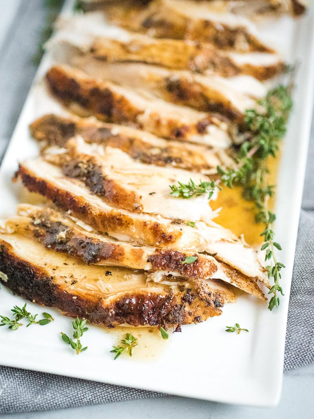 sliced turkey breast on plate with gravy