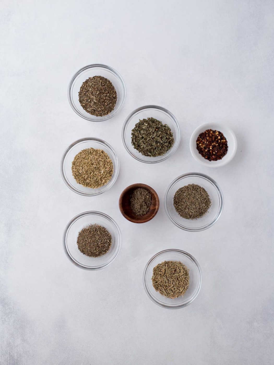 Ingredients needed to make from-scratch italian seasoning.