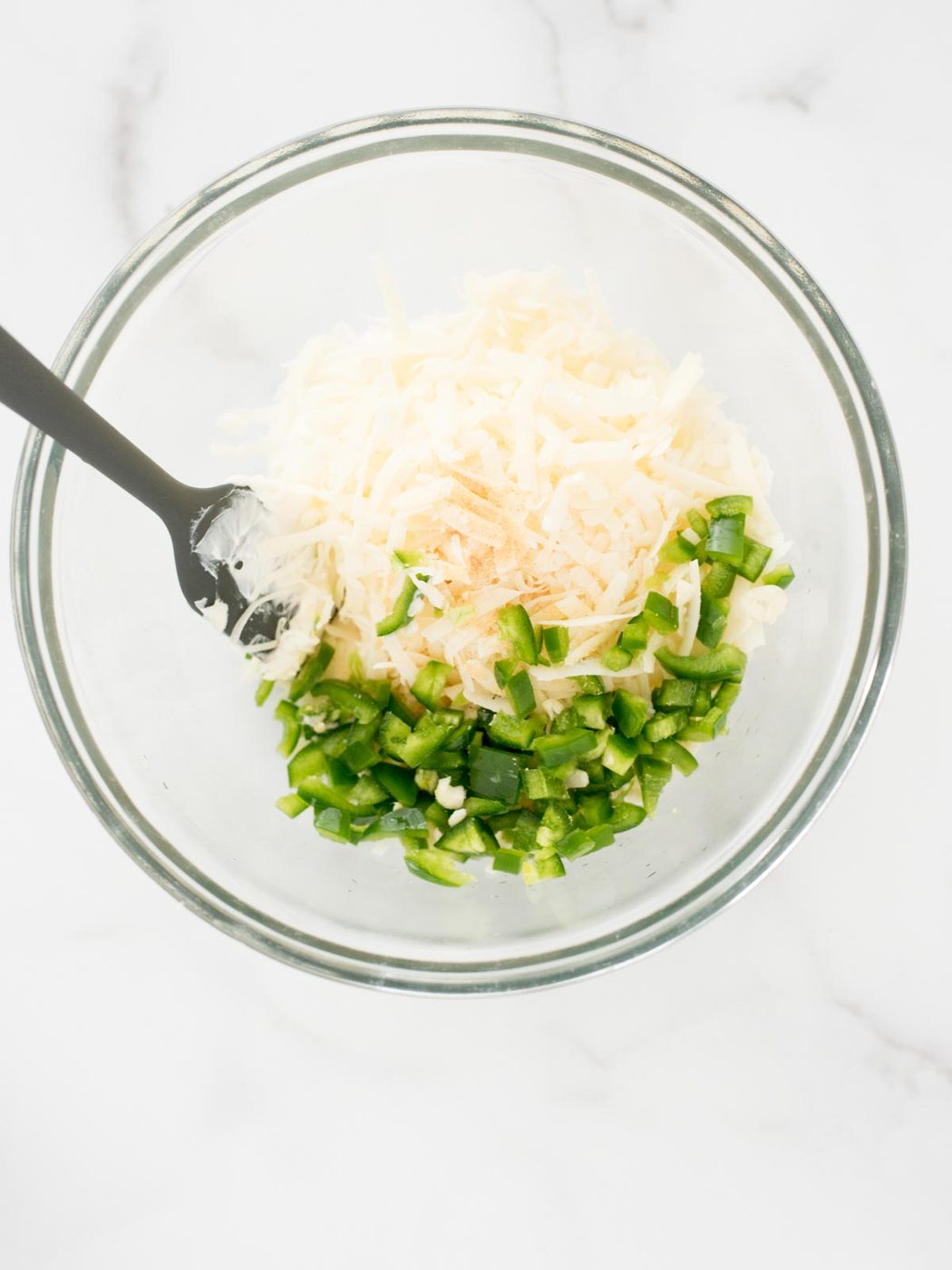 garlic cloves and jalapeno added to bowl