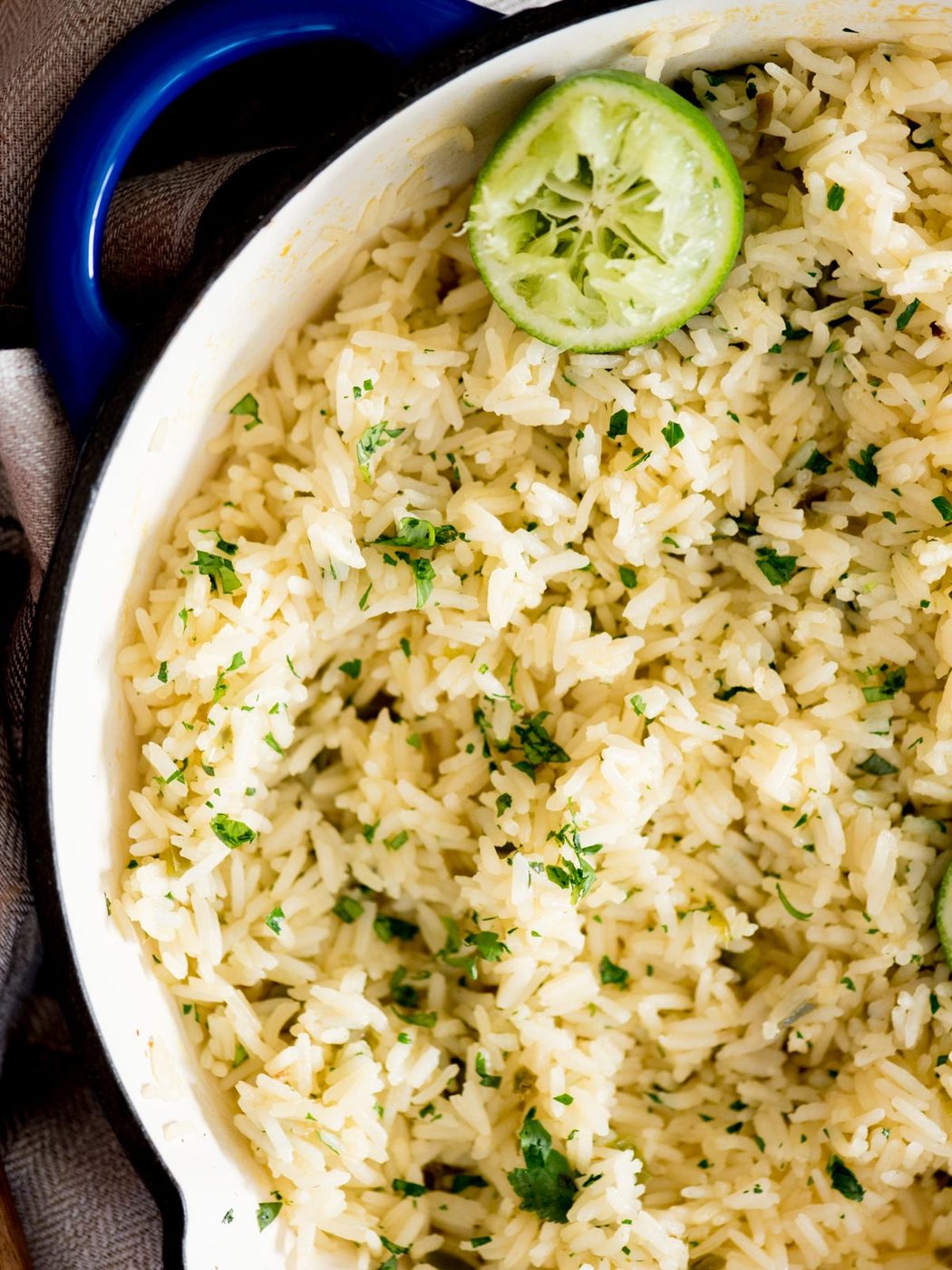 chili lime rice in a skillet topped with cilantro