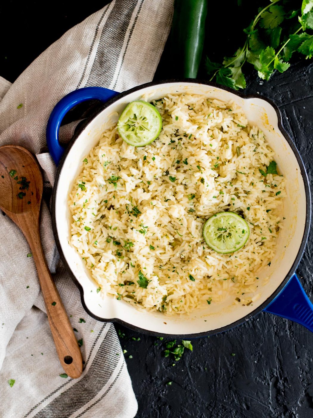 chili lime rice in a skillet topped with cilantro