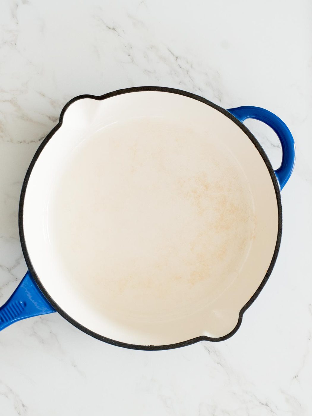 empty enamel cast iron skillet