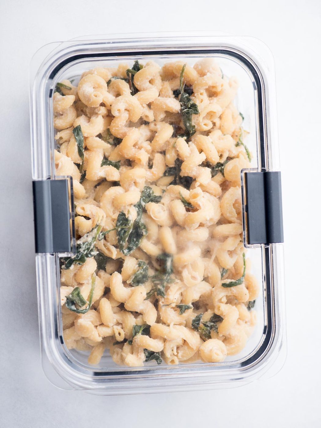 Lemon ricotta pasta in an airtight container.