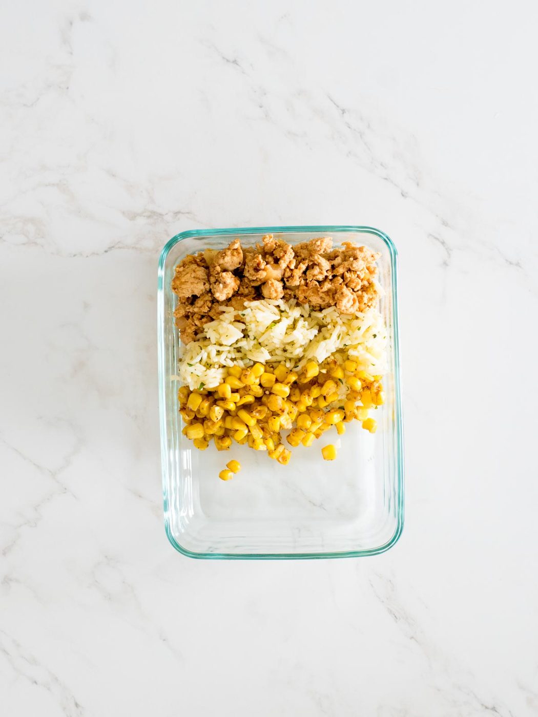 turkey, rice, and corn in glass container