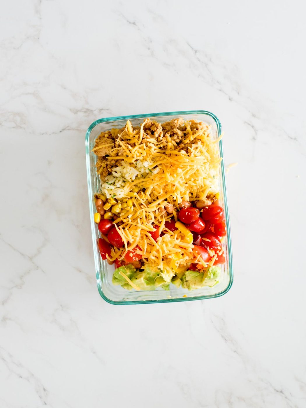 turkey taco bowls in a glass container