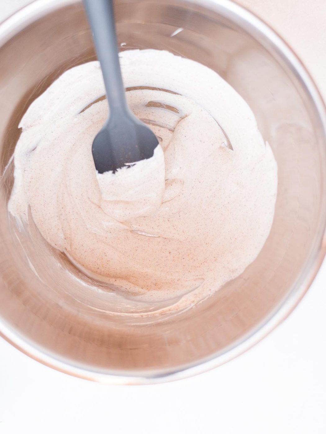 Mixing bowl with sour cream, mayo, seasonings and lime juice.