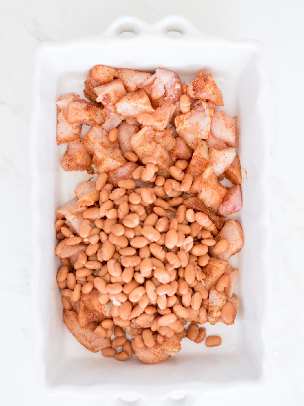 chicken and beans in baking dish