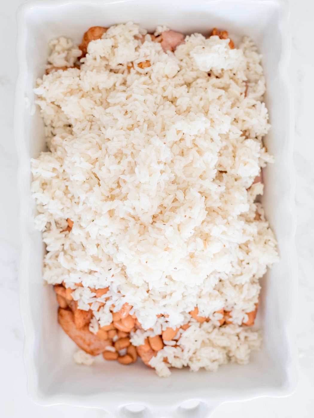 rice beans and chicken in casserole dish