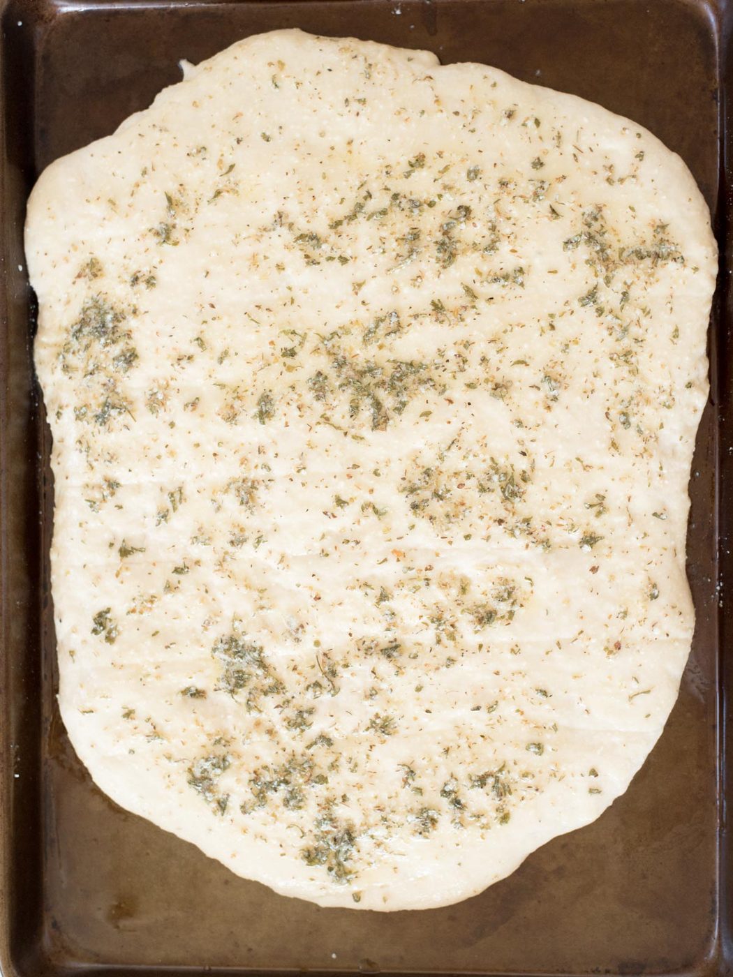 dough brushed with butter herb mix